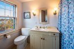 Twin bedroom en suite with tub/shower combo and pleasant water views